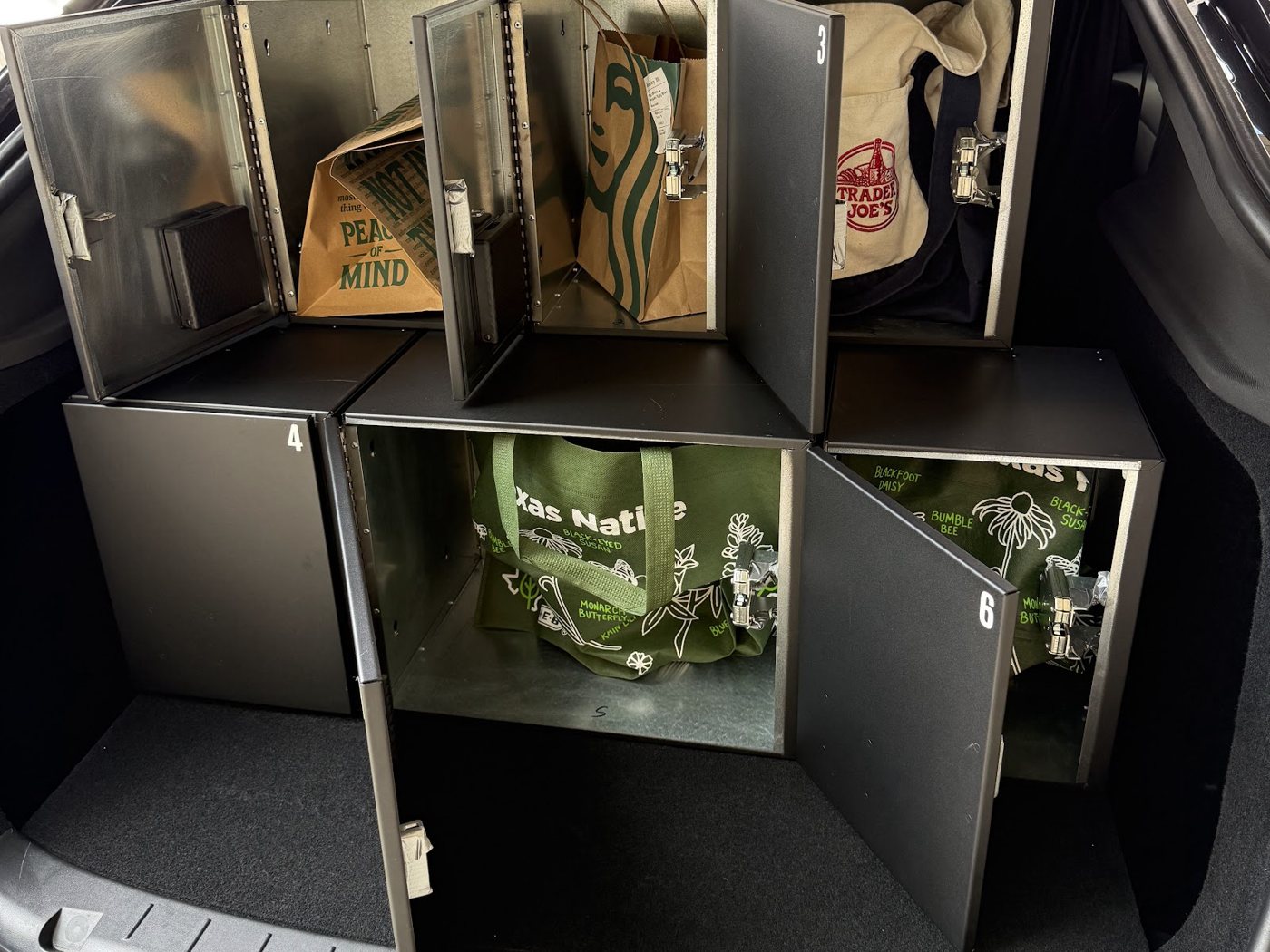 Autolane lockers open in a Tesla with real orders inside