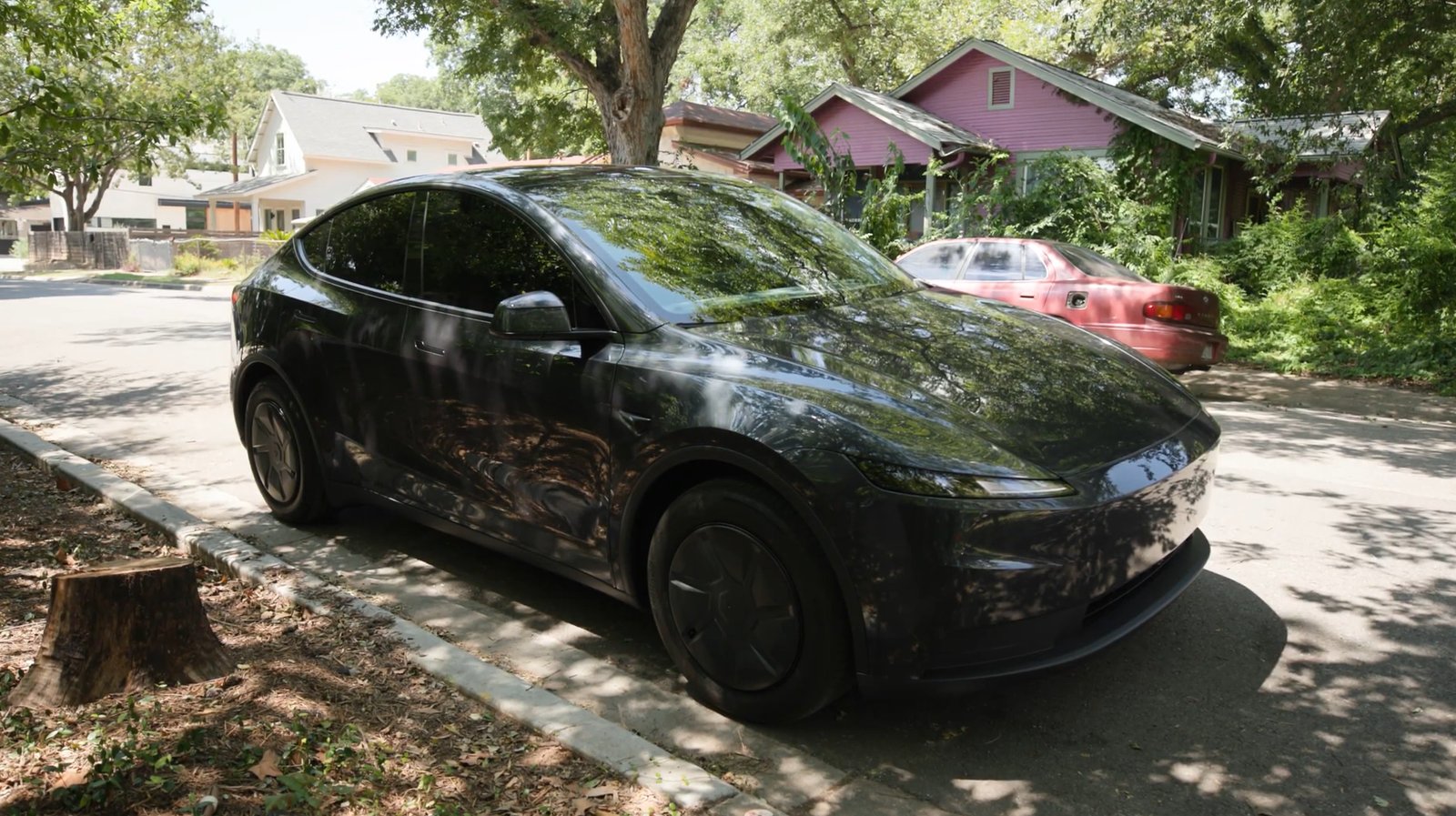 Tesla with the lockers parked at the curb